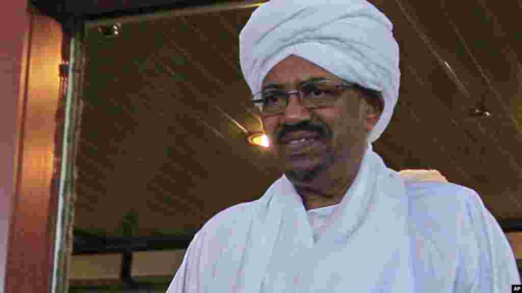 Sudanese President Omar al-Bashir walks out of a hotel in Abuja.