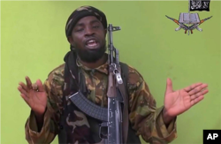 In this photo taken from video by Nigeria's Boko Haram terrorist network, May 12, 2014 shows their leader Abubakar Shekau speaking to the camera.
