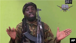 FILE - A photo taken from a video by Nigeria's Boko Haram militant group in May 2014 shows their leader Abubakar Shekau speaking to a camera.