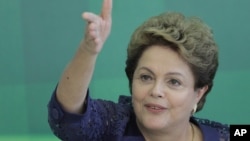 Brazil's President Dilma Rousseff speaks during a press conference at the Planalto Presidential Palace, in Brasilia, Dec. 22, 2014.