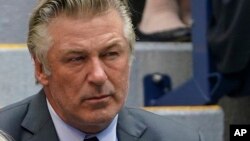 FILE - Alec Baldwin watches the men's singles final of the US Open tennis championships,Sept. 12, 2021, in New York.