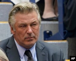 FILE - Alec Baldwin watches the men's singles final of the U.S. Open tennis championships, Sept. 12, 2021, in New York.