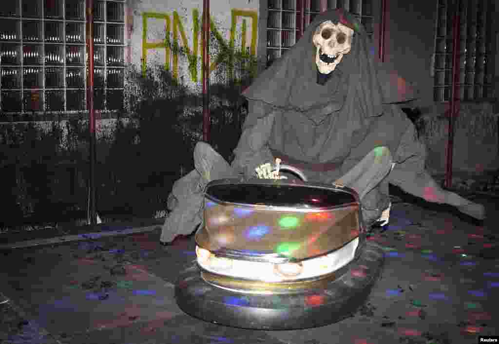 A Grim Reaper figure, riding a bumper car, is the newest art installation by British artist Banksy in New York, Oct. 25, 2013.