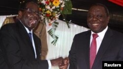 President Robert Mugabe and Prime Minister Morgan Tsvangirai at the constitution signing ceremony