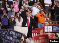 FILE - U.S. President Donald Trump leads a rally marking his first 100 days in office in Harrisburg, Pa., April 29, 2017.