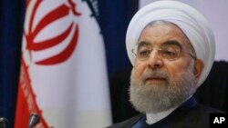 FILE - Iran's President Hassan Rouhani listens to a news conference during his visit for the United Nations General Assembly in New York, Sept. 20, 2017.