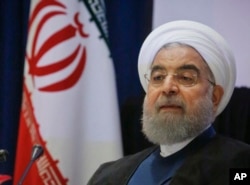 FILE - Iran's President Hassan Rouhani listens to a news conference during his visit for the United Nations General Assembly in New York, Sept. 20, 2017.