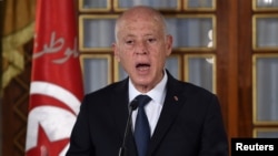 FILE - Tunisia's President Kais Saied gives a speech at the government's swearing-in ceremony at the Carthage Palace outside the capital Tunis, Tunisia, Feb. 27, 2020. 