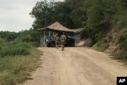 U.S. National Guard troops guard the border in Roma, Texas, April 10, 2018.