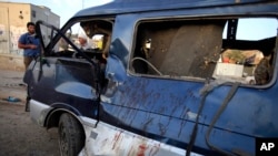 The aftermath of a car bomb in Sadr City, Baghdad, May 16, 2013.