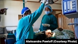 An Ethiopian surgeon prepares to operate on a patient with trichiasis.