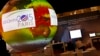 A giant globe displays a video animation during a conference about Antarctic mass change at the U.S. Pavillon during the COP21, United Nations Climate Change Conference, in Le Bourget, outside Paris, Tuesday, Dec. 1, 2015.