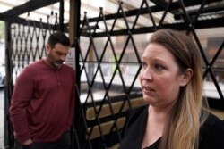 Caitlin Foster stands outside the Noir Lounge she manages in Hayes Valley and talks about the declining quality of life in San Francisco, Dec. 2, 2021.