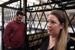 Caitlin Foster stands outside the Noir Lounge she manages in Hayes Valley and talks about the declining quality of life in San Francisco, Dec. 2, 2021.