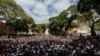 A crowd of opposition supporters gather to listen to Venezuela's National Assembly head and the country's self-proclaimed "acting president" Juan Guaido, at Bolivar Square in Chacao, eastern Caracas, on Jan. 25, 2019.