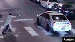 A still image from surveillance video shows a gunman approaching a Philadelphia police vehicle in which Officer Jesse Hartnett was shot shortly before midnight Jan. 7, 2016, in Philadelphia, Pennsylvania.