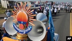The logo of opposition Cambodia National Rescue Party (CNRP) is displayed before a rally on the first day of the country's commune election campaign at outside Phnom Penh, Cambodia, Saturday, May 20, 2017. (AP Photo/Heng Sinith)