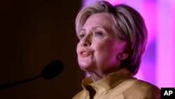 FILE - Former Secretary of State Hillary Clinton speaks during a fundraising event for Big Sister Association of Greater Boston, Dec. 5, 2017, in Boston. 