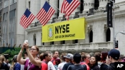 A Snapchat banner hangs on the facade of the New York Stock Exchange, June 16, 2017.