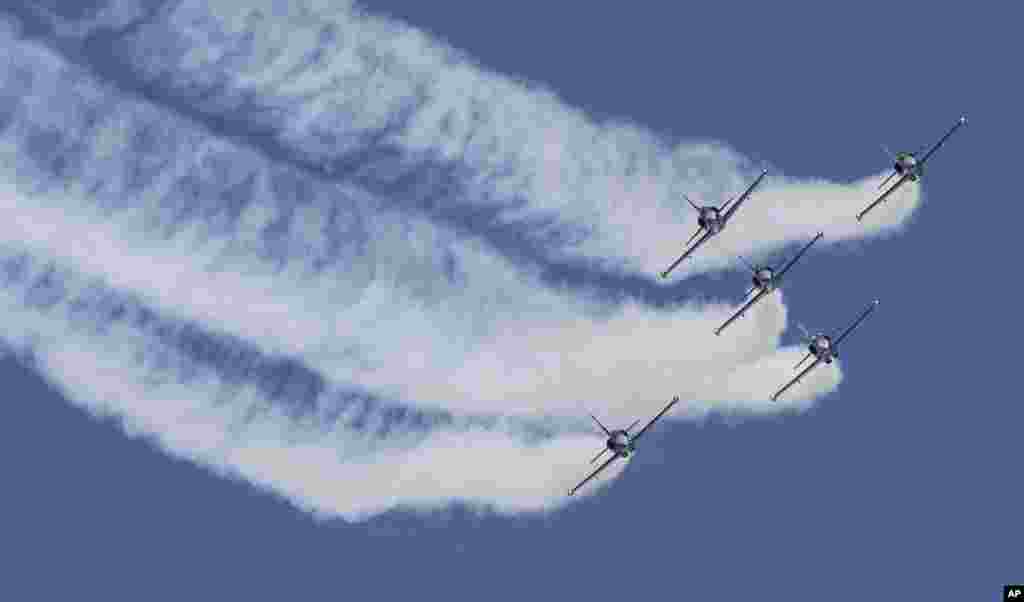 Aero Albatros jets of the Breitling Jet Team perform during an aerobatics display at the Subang Skypark near Kuala Lumpur, Malaysia.