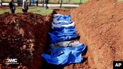  A mass burial of people allegedly killed by Syrian Army snipers, in Al. (File)