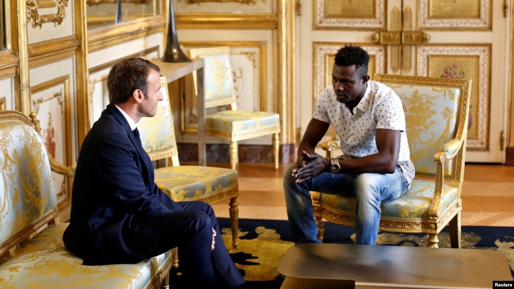 French President Emmanuel Macron meets with Mamoudou Gassama, 22, from Mali, at the Elysee Palace in Paris, May 28, 2018.