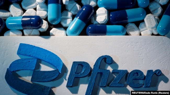 FILE - A Pfizer logo is placed near medicines from the same manufacturer in this illustration taken September 29, 2021. (REUTERS/Dado Ruvic/Illustration/File Photo)