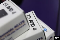 File - In this photo taken on May 14, 2018, boxes holding cell phones manufactured by ZTE are seen in a store in Miami, Florida.