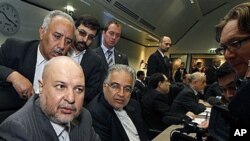 Iran's Minister of Petroleum Masoud Mir-Kazemi, left, speaks to journalists prior to the start of the meeting of the Organization of the Petroleum Exporting Countries at their headquarters in Vienna, Austria, 14 Oct 2010