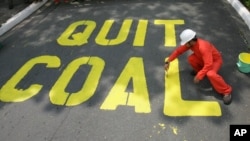 FILE - Activists protest the use of coal in the Philippines, June 3, 2008. Decreasing the world's reliance on coal and other fossil fuels is key to global health, said participants Thursday at the World Climate Summit in Washington.