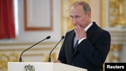 Russia's President Vladimir Putin delivers a speech at the Kremlin in Moscow, Russia, May 28, 2015.