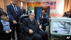 FILE - Algerian President Abdelaziz Bouteflika looks on after voting in Algiers, May 4, 2017.