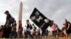 Juggalos, as supporters of the rap group Insane Clown Posse are known, march past the Washington Monument as they head towards the Lincoln Memorial in Washington during a rally, Sept. 16, 2017. 