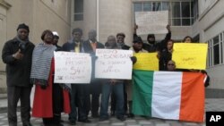 These pro-Ouattara protesters outside the Ivory Coast embassy in Washington support the current U.S. policy, but others are more reserved.