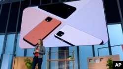 Sabrina Ellis, Vice President Of Product Management at Google, speaks during the announcement of the Pixel 4 (on screen) Tuesday, Oct. 15, 2019, in New York. (AP Photo/Craig Ruttle)