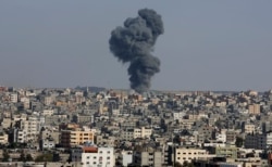 Smoke rises after an Israeli airstrike in Gaza City, the Gaza Strip, Wednesday, May 12, 2021. (AP Photo/Adel Hana)