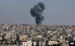 Smoke rises after an Israeli airstrike in Gaza City, the Gaza Strip, Wednesday, May 12, 2021. (AP Photo/Adel Hana)
