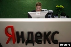 FILE - An employee works at Yandex headquarters in Moscow, Russia, Dec. 2, 2014.