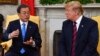 South Korean President Moon Jae-in, left, confers with U.S. President Donald Trump in the Oval Office at the White House in Washington, April 11, 2019.