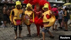 Revellers take part in the annual block party known as "Carmelitas," during carnival festivities in Rio de Janeiro, March 1, 2019.