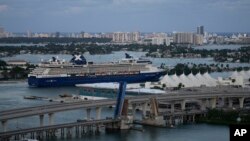 FILE - A cruise ship arrives at port in Miami, Florida, Oct. 18, 2021.