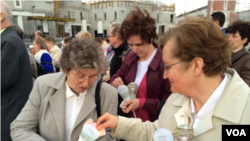 Every 22nd of the month since Pope John Paul II's death, people in his hometown have been holding a vigil, hoping he would be canonized, Crakow, Poland, April 22, 2014. (Jerome Socolovsky/VOA)