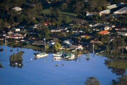 Sebagian bangunan di kawasan Windsor, barat laut Sydney, Australia, terendam air banjir, Rabu 24 Maret 2021.