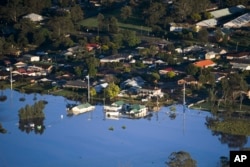 Sebagian bangunan di kawasan Windsor, barat laut Sydney, Australia, terendam air banjir, Rabu 24 Maret 2021.