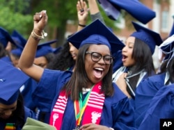 FILE - Ciearra Jefferson celebrates her graduation with her class after President Barack Obama spoke at Howard University's commencement exercises in Washington, May 7, 2016.