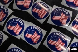 Voters cast their ballots at City of Miami fire station 7 in Miami, Florida on November 3, 2020. (Photo by Eva Marie UZCATEGUI / AFP)