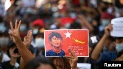 People rally in a protest against the military coup and to demand the release of elected leader Aung San Suu Kyi, in Yangon, Myanmar, February 8, 2021. (REUTERS/Stringer)
