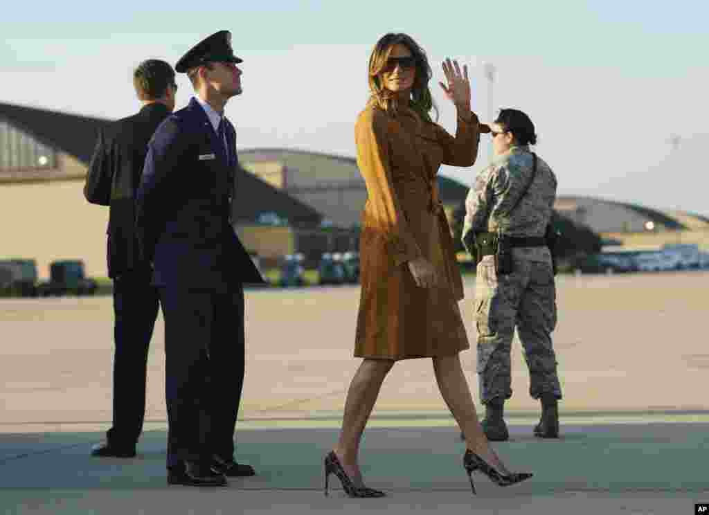 First lady Melania Trump waves as she boards a plane, Oct. 1, 2018, in Andrews Air Force Base, Md., en route to Africa.