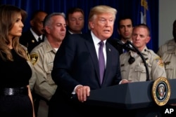 President Donald Trump speaks after meeting with first responders and private citizens who helped during the mass shooting, at the Las Vegas Metropolitan Police Department, Oct. 4, 2017, in Las Vegas.