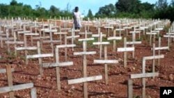 FILE - Crosses stand as a memorial to the hundreds of thousands of victims of the 1994 Rwandan genocide.